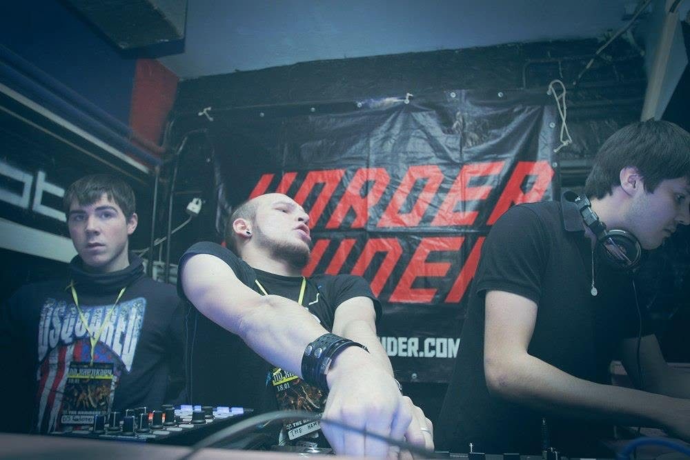 Three DJs performing at a Harder & Louder night